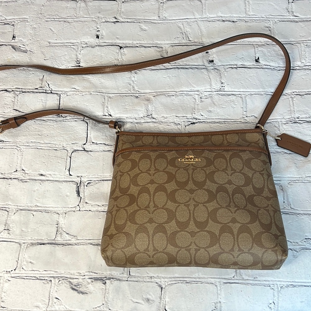 Coach Brown cc print leather Crossbody,small bag, but small things  feet